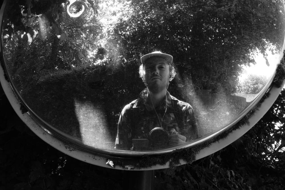 The author’s smug looking expression reflected in a driveway mirror