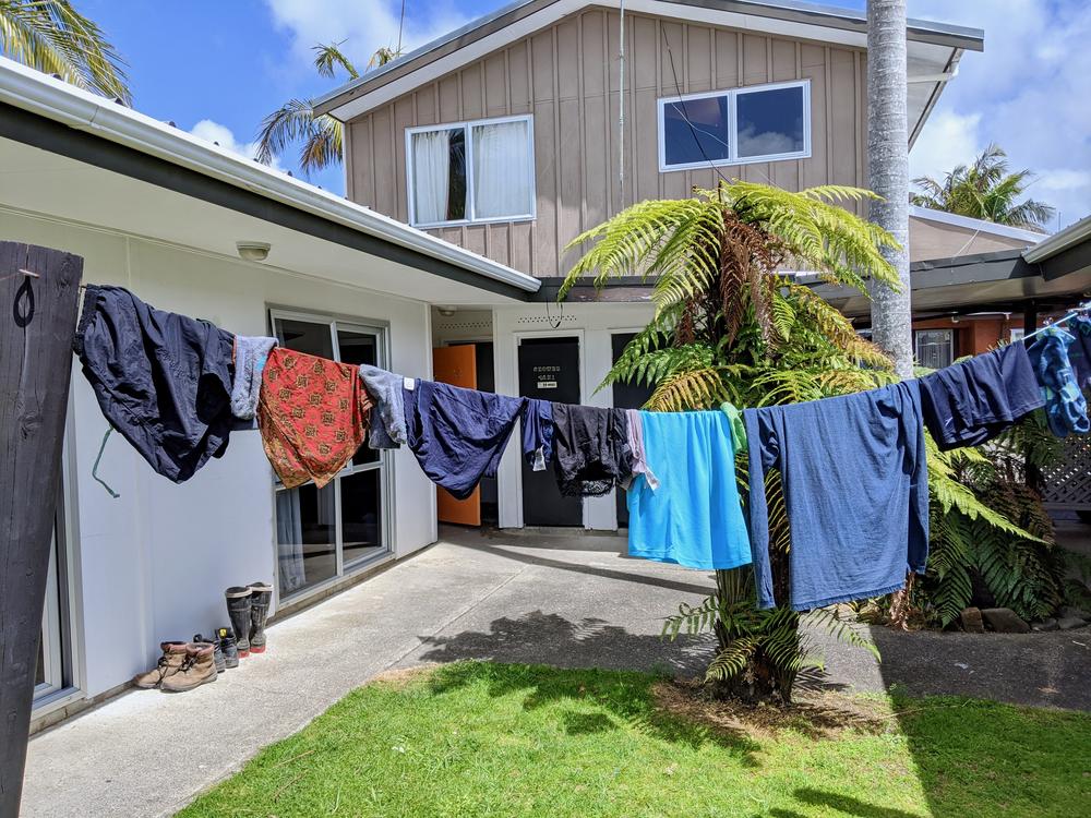 Our hand washed clothes hanging on a line at the hostel.